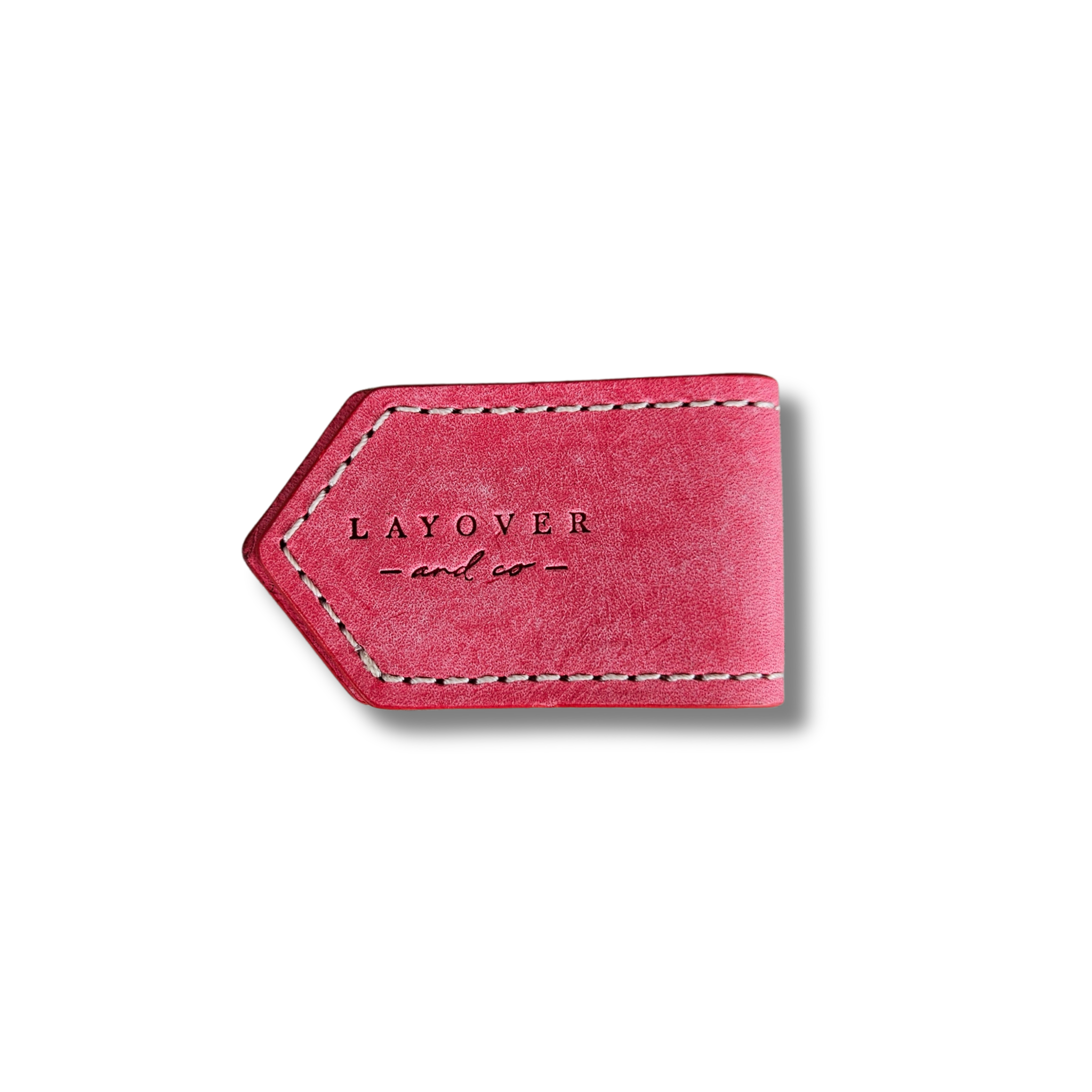 Side view of leather bookmarks in pink with an embossed logo, smooth texture, rounded edges, fine stitching, and minimalist design.