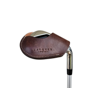 Studio shot of leather magnetic golf iron covers in brown neatly arranged to showcase their smooth texture, precise stitching, and minimalist design under soft lighting.