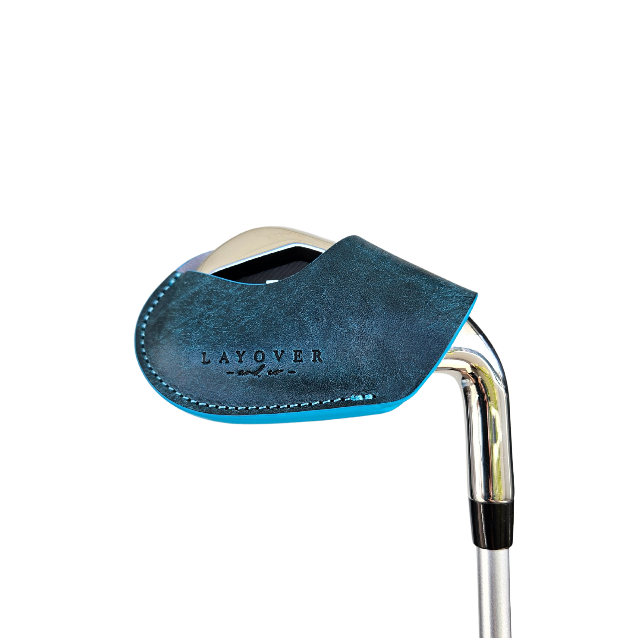 Studio shot of leather magnetic golf iron covers in emerald green neatly arranged to showcase their smooth texture, precise stitching, and minimalist design under soft lighting.