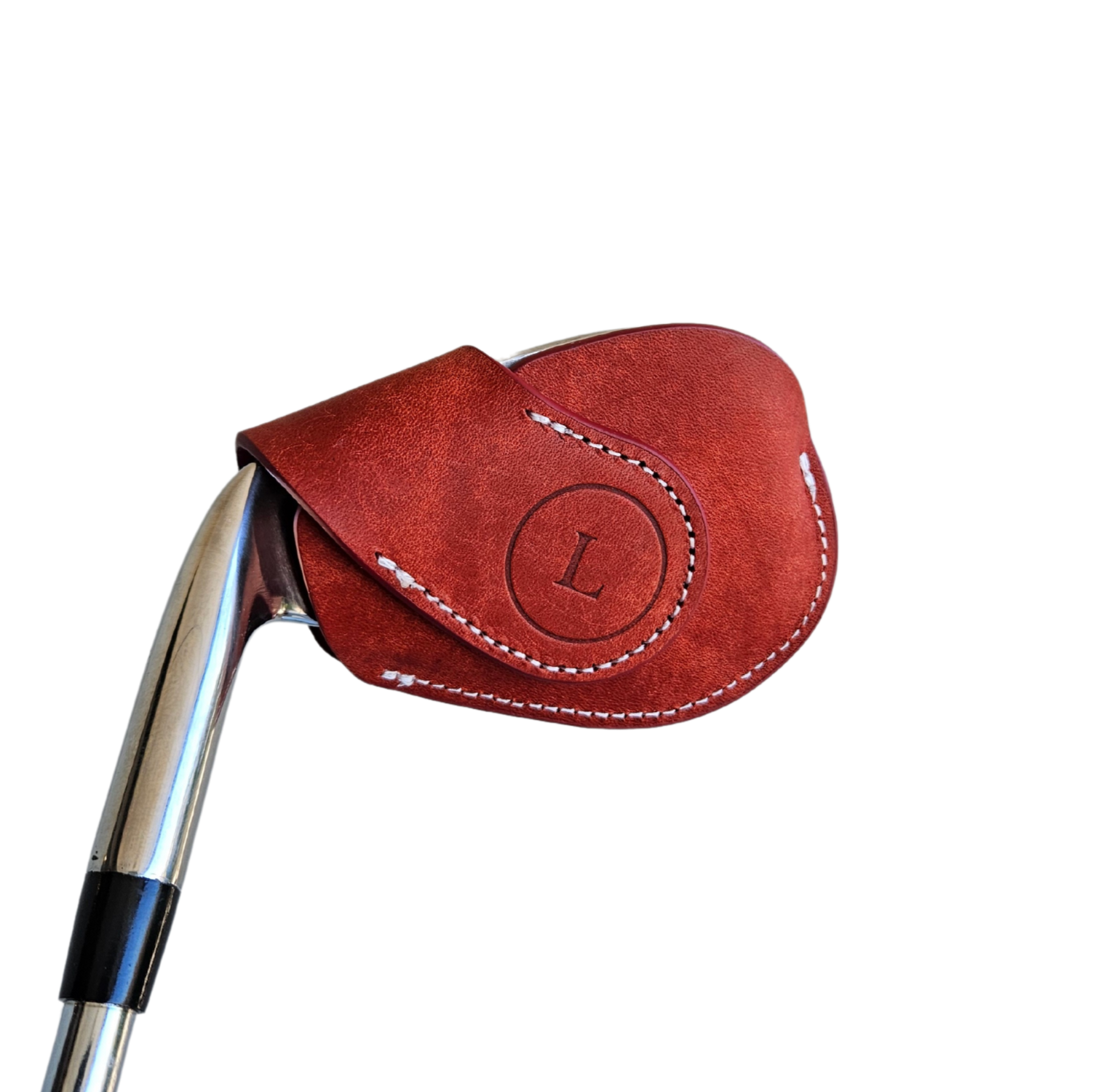 Studio shot of leather magnetic golf iron covers in red neatly arranged to showcase their smooth texture, precise stitching, and minimalist design under soft lighting.