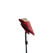 Studio shot of leather magnetic golf iron covers in red neatly arranged to showcase their smooth texture, precise stitching, and minimalist design under soft lighting.
