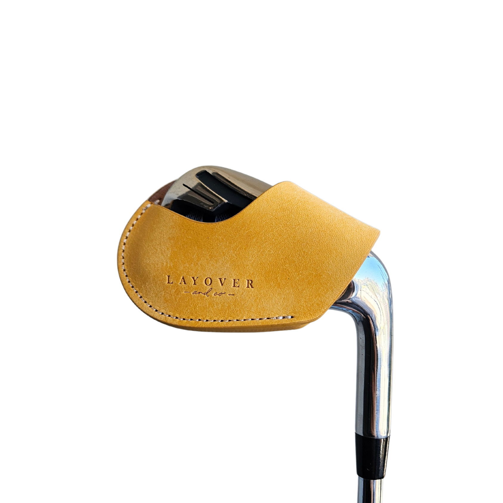 Studio shot of leather magnetic golf iron covers in yellow neatly arranged to showcase their smooth texture, precise stitching, and minimalist design under soft lighting.
